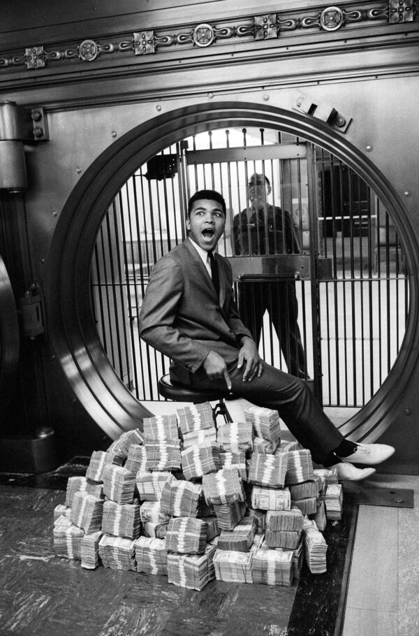 Ali-Sitting on $$